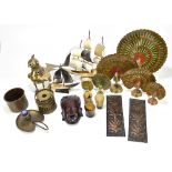 An assortment of Eastern and European metalware including a beaker with embossed stylised decoration