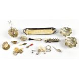 A small collection of hallmarked silver items including a miniature two handled tray, a menu holder,
