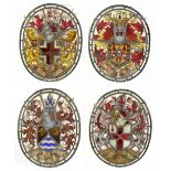 A set of four 18th/19th century leaded stained glass oval panels, each with Latin inscription and