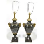 A pair of late 19th century French grey veined marble and ormolu mounted table lamps, with ram's