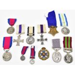 A selection of medals and copy medals, comprising a Military Cross dated 1945, a copy of a