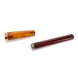 A 9ct gold mounted amber cheroot holder, length 6cm, cased, and a cherry amber cheroot holder with