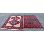 A Caucasian hand woven wool rug decorated with an allover panel of geometric gulls against a blue