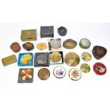 A collection of compacts and decorative boxes.