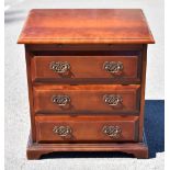 A reproduction mahogany chest of drawers, with slide above three drawers, on bracket feet, height