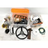 A collection of various classic car parts including Austin, ignition coils, engine cooling, hose