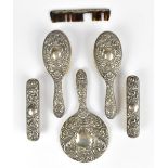 BROADWAY & CO;  a hallmarked silver six piece dressing table set, decorated with the Green Man,