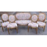 A French Louis XVI style giltwood five-piece salon suite comprising canapé, width 120cm, two