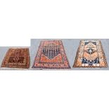 Three Persian wool rugs, the largest worked with a central medallion with allover floral design