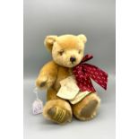 MERRYTHOUGHT; an Ironbridge teddy bear, with bow.