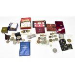 A collection of coins including United States Proof Set, commemorative crowns and a silver dollar.