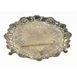 EBENEZER COKER; a George III hallmarked silver waiter, with shaped rim, London 1763, diameter