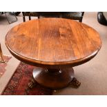 A 19th century rosewood tilt-top breakfast table, the circular top raised on a octagonal baluster