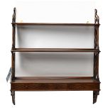 GOSTIN; a reproduction hanging wall shelf in a Chippendale style, with pierced sides and three fixed