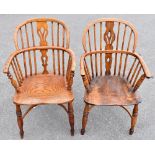 Two 18th century elm seated low Windsor back armchairs with crinoline stretchers on turned column