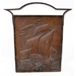 An Arts & Crafts Newlyn style embossed copper panel decorated with a ship, overall height 74cm,