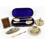 A mixed group of hallmarked silver items including a cased pair of spoons, a nail buffer, a