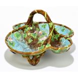 GEORGE JONES & SONS; a majolica strawberry bowl, with moulded floral decoration on a turquoise and