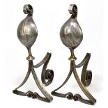 A pair of Arts & Crafts style steel fire dogs on shaped, triangular and scrolling bases, height 46cm