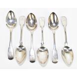 A set of six George IV hallmarked silver Fiddle pattern dessert spoons with bird engraved crest to