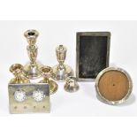 A.T CANNON LTD; a pair of Elizabeth II hallmarked silver squat candlesticks with a cast beaded