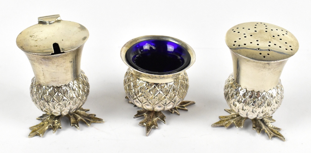 FENTON BROS LTD; a George V hallmarked silver three piece cruet, in the shape of thistles, Sheffield