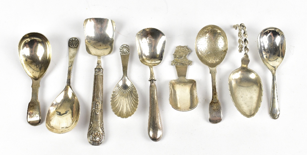 A small collection of hallmarked silver caddy spoons, and two plated examples, weighable silver