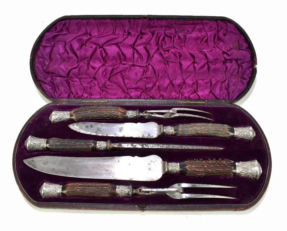 W.T WYATT SILVERSMITH, BLANDFORD; a cased four piece carving set with hallmarked silver ferrules,