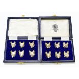 ASPREY; a set of twelve Elizabeth II hallmarked silver fox head place name holders set in two six