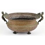 An 18th century French embossed copper oval wine cooler with twin winged mythical caryatid