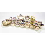 A collection of 19th century porcelain teacups and saucers including an example in the manner of