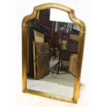 A modern gilt framed shaped wall mirror, height 100cm, width 64cm.