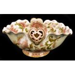ZSOLNAY PECS; a footed bowl with wavy rim and heart shaped motifs, with painted floral decoration,