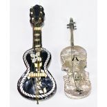 A Continental white metal model of a guitar with repoussé decoration, length 8.5cm, and a