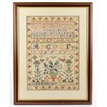 A Victorian needlework sampler, worked by Anne McCose and dated 1859, worked with alphabets and