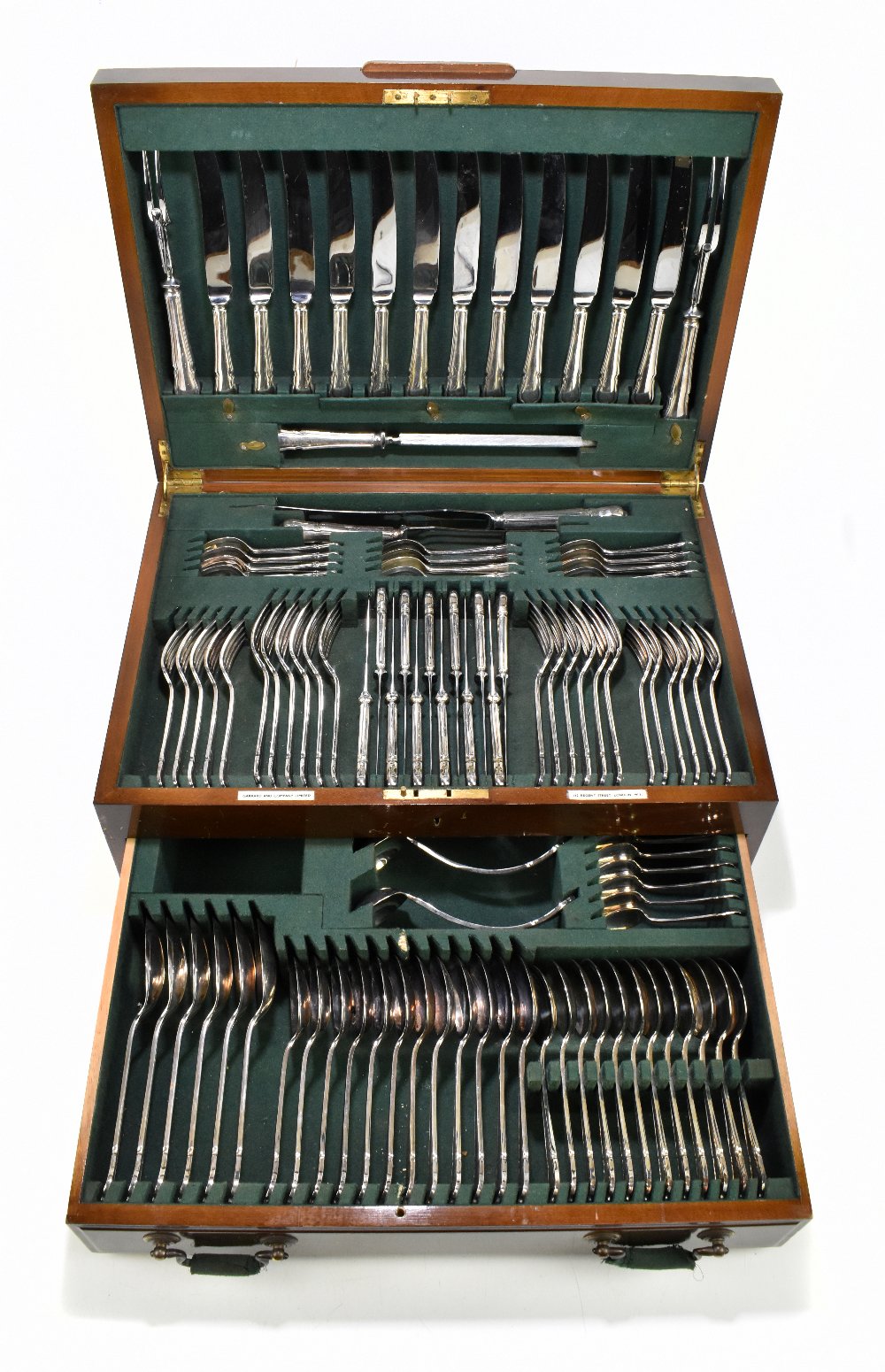 GARRARD & CO; a 1940s walnut cased twelve setting canteen of plated cutlery (one side fork