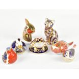 ROYAL CROWN DERBY; a collection of seven animal paperweights, comprising seated cat and seated frog,