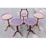 An Edwardian inlaid mahogany folding cake stand, height 74cm, and two pairs of tripod tables (5).