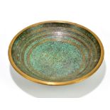 A contemporary patinated bronze footed bowl with gilt linear decoration, impressed indistinct mark