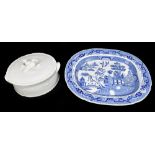 A large blue and white oval 'Willow' pattern meat plate with tree shaped reservoir, length 48cm,