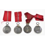 Four WWII period East medals, fitted in original packaging.