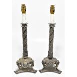 A pair of 19th century silver plated candlesticks converted to table lamps, with wrythen twisted