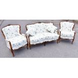 A French Louis XV style carved beech three piece salon suite, comprising two seater settee and two