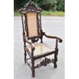 A late 19th century Continental stained beech armchair of 17th century design, with caned back and