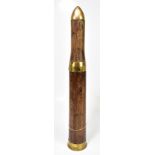 A WWII 57mm six pounder 700 weight practice drill round, brass mounted wood, length 59cm.