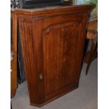 A 19th century oak hanging corner cupboard with crossbanded decoration to the door, height 103cm,