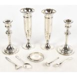 A pair of hallmarked silver candlesticks, with oak loaded bases, Birmingham 1912, height 16cm, a