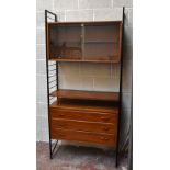 LADDERAX; a teak three drawer chest, with a glazed door unit, single shelf, two side supports, and