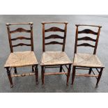 Three 19th century Macclesfield oak and ash rush seated country chairs (3).