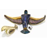 A mid-20th century German base metal and enamel decorated bird ornament of South American influence,